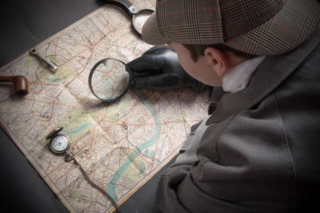 Detective man- magnifying glass, map of London, clock on chainの写真素材