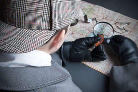 Detective man- magnifying glass, map of London, clock on chainの写真素材
