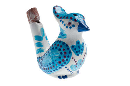 whistle in the shape of a bird on whiteの写真素材
