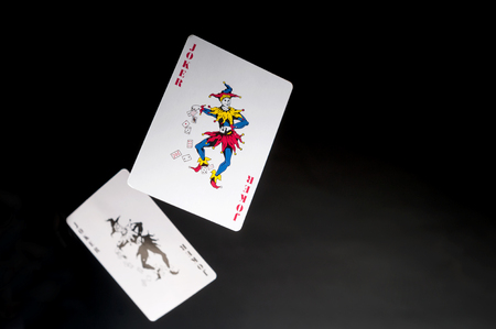 flying playing cards on a dark background- Two Jokersのeditorial素材