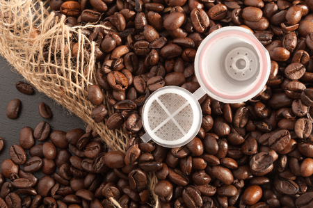 grain coffee in sackcloth with coffee capsuleの写真素材
