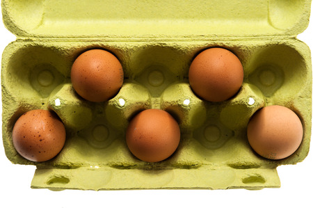 brown chicken eggs in a pack isolated on white