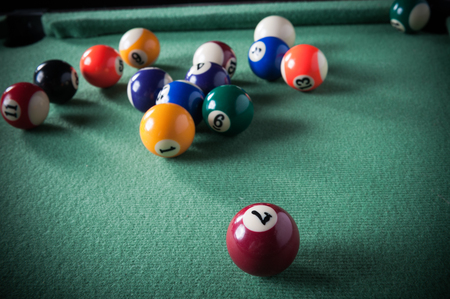billiard table with green material and billiard ballsの写真素材