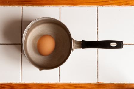 boiled brown egg in the aluminum panの写真素材