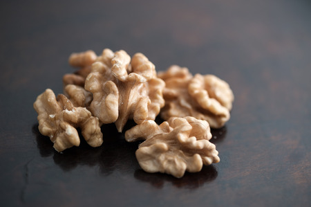 dried walnut without shell on a dark background