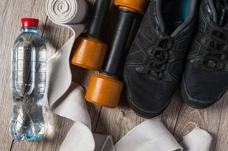 fitness set sneakers with dumbbells, water bottle and elastic bandageの写真素材