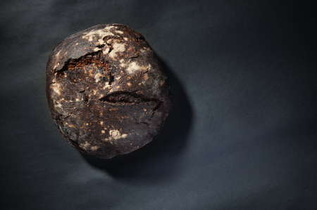 buckwheat bread with prunes on dark backgroundの写真素材