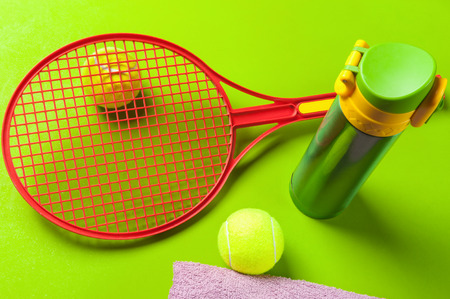 tennis set  on green backgroundの写真素材