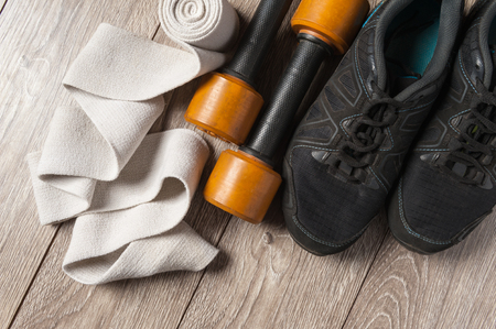 flat lay sport accessories elastic bandage with dumbbellsの写真素材