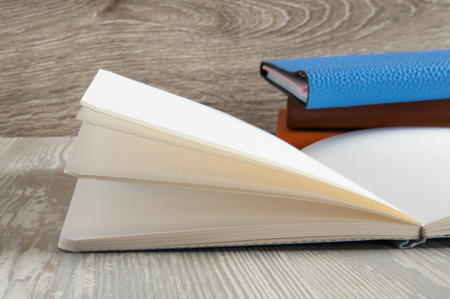 open blank notebook on wooden tableの写真素材
