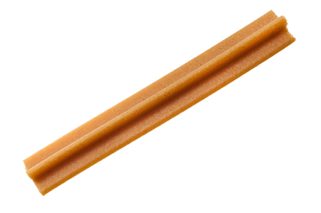 tendon sticks for gum massage in dogs isolated on whiteの写真素材