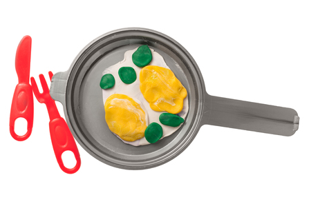 Toy from plasticine fried eggs in a panの写真素材
