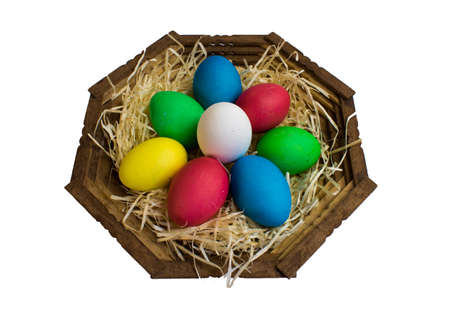 Easter eggs in a basket on a white background isolateの写真素材