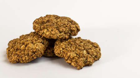 Cookies oatmeal nuts on a plate close-up on a white backgroundの写真素材
