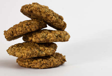 Cookies oatmeal nuts on a plate close-up on a white backgroundの写真素材