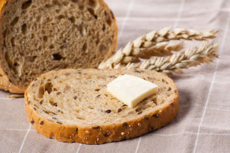Tasty piece of bread with butter 