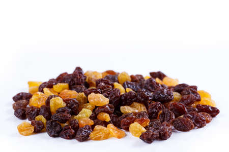 Heap of sultana raisins on white 