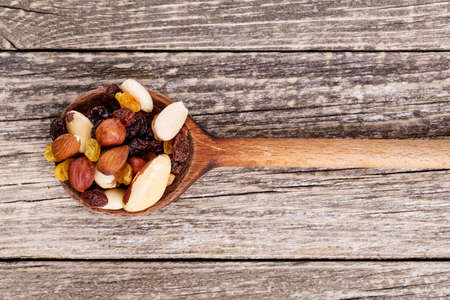 Mixed nuts on a wooden background.の写真素材