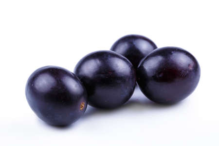 Delicious grapes on a white background.