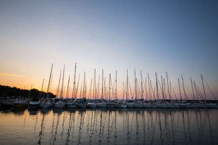 Sailboats marinas with sunset in Croatia.の写真素材
