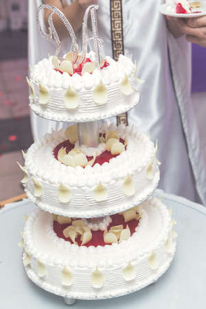 A beautiful wedding cake with cream.の写真素材