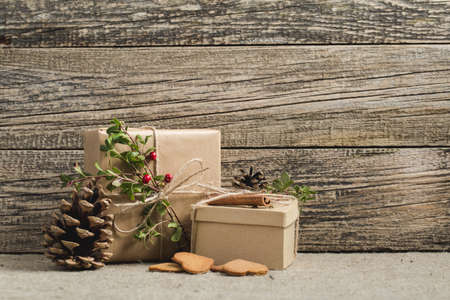 Handmade christmas or New Year gifts on wooden background.の写真素材