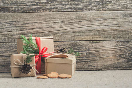 Handmade christmas or New Year gifts on wooden background.の写真素材