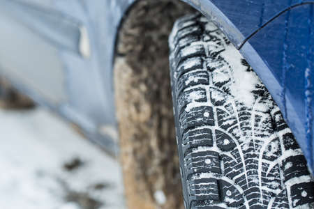 Car tires on winter road.