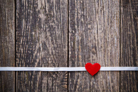 Wooden background with red hearts on Valentine's day.の写真素材