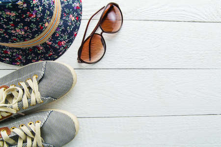 Tourist stuff for traveling on wooden background.の写真素材