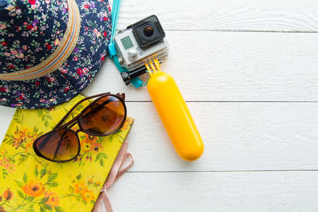 Stuff for traveling on white wooden background.の写真素材