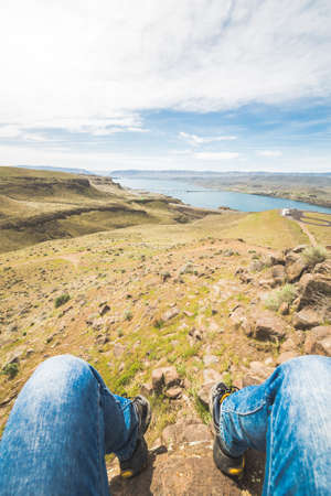 Tourist watching rural view of american fields and river in spring.の写真素材