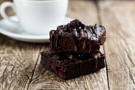 Delicious vegetarian brownie slice for gourmet on wooden table.の写真素材