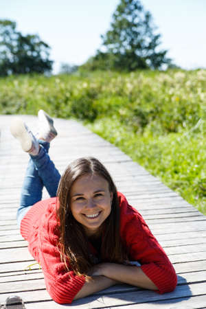 Beautiful woman at walk in summer day.の写真素材