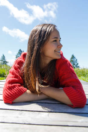 Beautiful woman at walk in summer day.の写真素材