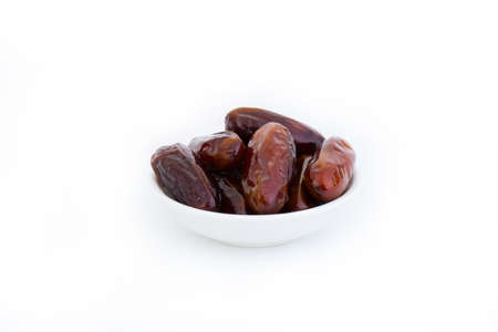 Tasty dates isolated on white background.