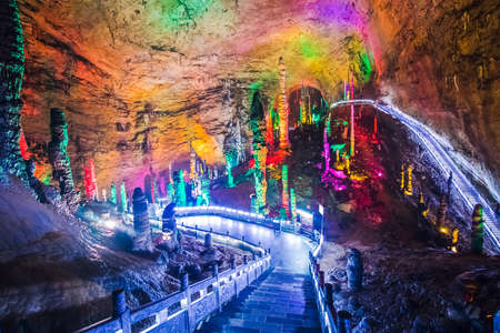 Big colorful cave with stalactite and brigde in Chinaの写真素材