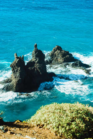 Viewpoint on Famous Benijo Rock with ocean waves crushing located at Benijo Beach seen from above, Tenerife, Spainの写真素材