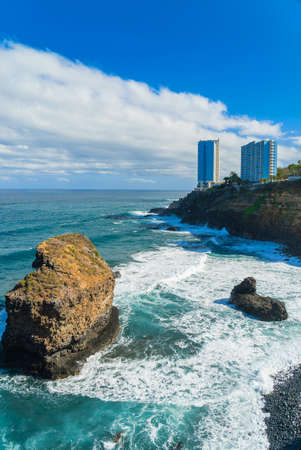 View on ocean shore and hotel buildings on the rock in Punta Brava, Puerto de la Cruz, Tenerife, Canary Islands, Spain.の写真素材