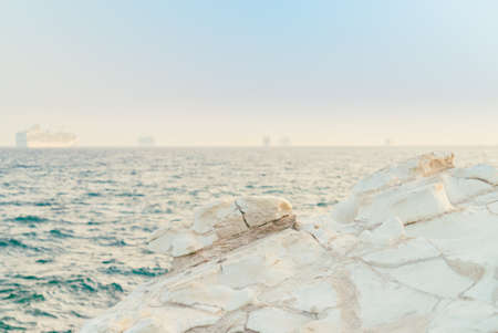 White stones or rocks beach on Cyprus. A view of a sea shore. White rocks and stone coast.