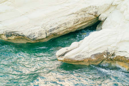 White stones or rocks beach on Cyprus. A view of a sea shore. White rocks and stone coast.の写真素材