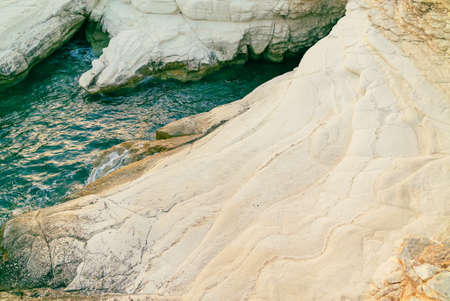 White stones or rocks beach on Cyprus. A view of a sea shore. White rocks and stone coast.の写真素材