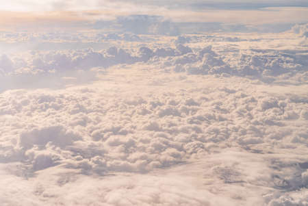 View over the clouds above Tanzania. Bright skyscape.