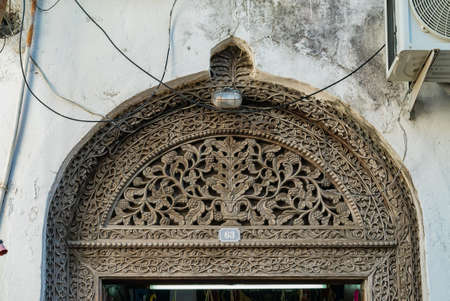 The top of antique Indian style Wooden Door in Stone Town, Zanzibar, Tanzania.