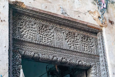The top of antique Indian style Wooden Door in Stone Town, Zanzibar, Tanzania.の写真素材
