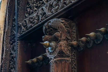 Close up of elements on antique Indian style Wooden Door in Stone Town, Zanzibar, Tanzania.の写真素材