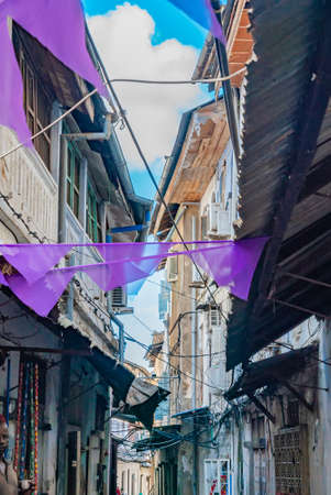 STONE TOWN, TANZANIA - December 22, 2021: Narrow streets and old houses in Stone town, Zanzibar, Tanzania.のeditorial素材