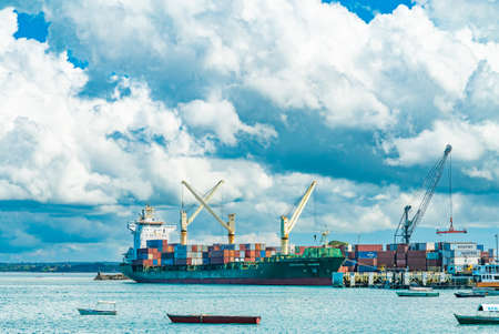 STONE TOWN, ZANZIBAR - DECEMBER 22, 2021: Boats and ships in a port of Stone Town, Zanzibar, Tanzania.のeditorial素材