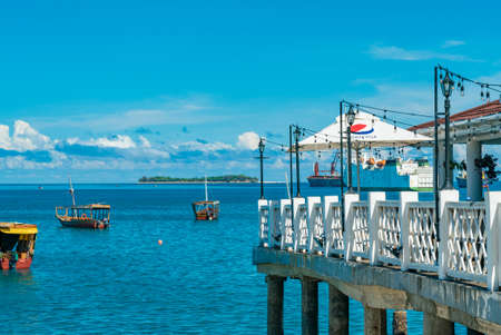 STONE TOWN, ZANZIBAR - DECEMBER 22, 2021: Boats in a port of Stone Town, Zanzibar, Tanzania.のeditorial素材