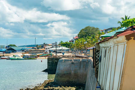STONE TOWN, ZANZIBAR - DECEMBER 22, 2021: Boats near beach in a port of Stone Town, Zanzibar, Tanzania.のeditorial素材